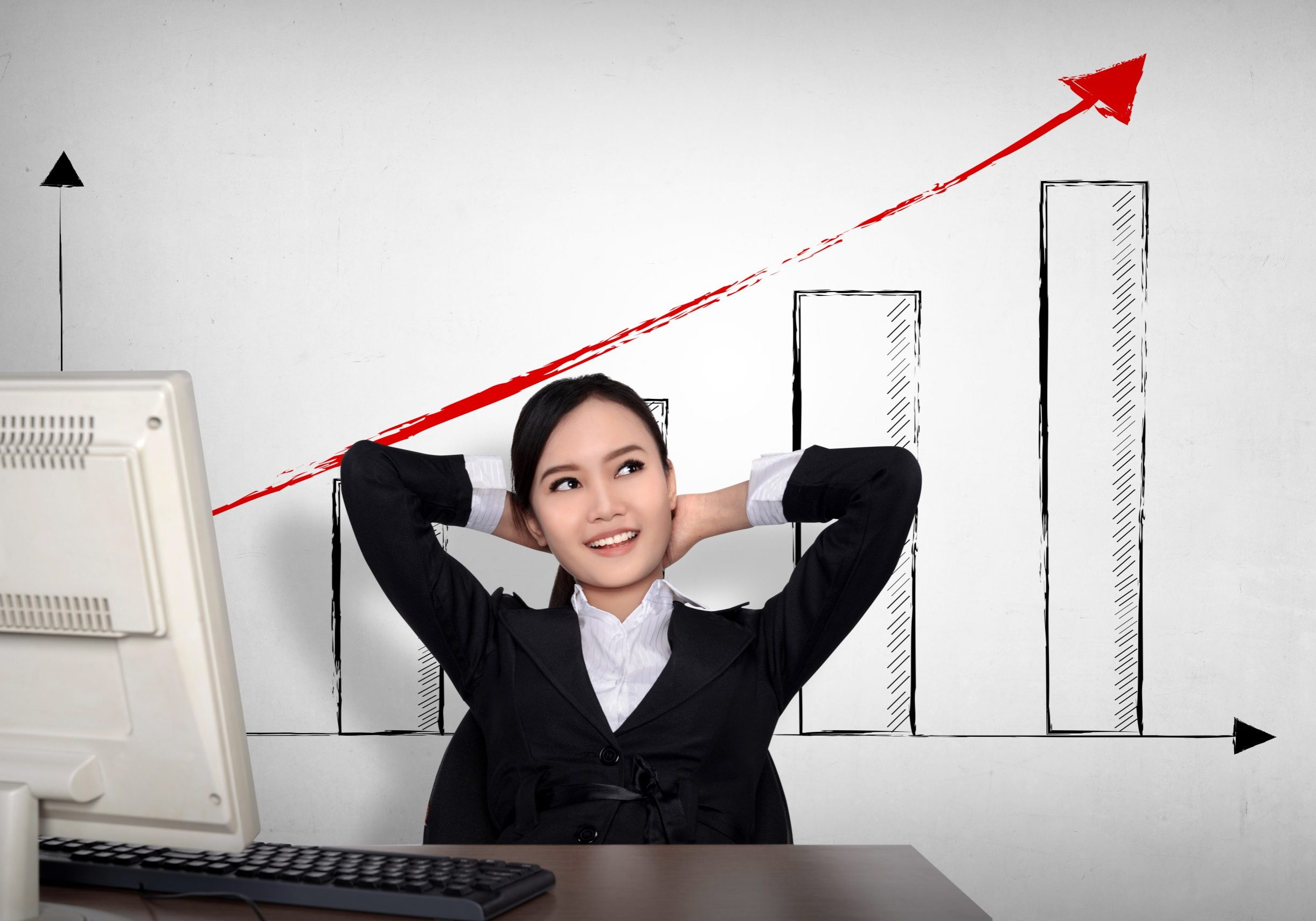 Successful asian business woman in front of computer. Business success concept